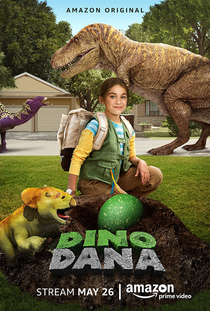 A girl with a rucksack kneels by a green dinosaur egg in a suburban garden, surrounded by various dinosaurs. The text reads "Dino Dana," with half-term streaming details and Amazon Prime branding—perfect for what to watch next!.
