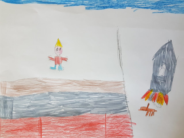 A child’s drawing from Creative with BIC Kids shows a person in a yellow hat on a multicoloured surface, while a black rocket with flames and smoke blasts off on the right. The sky is blue at the top.
