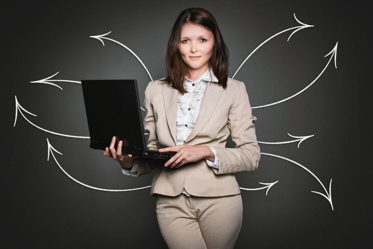 Woman using computer to search for group activities for adults in her local area