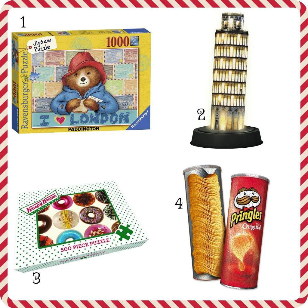 Four Jigsaw puzzles from left to right Paddington Bear 1000 piece puzzle, 3d light up leaning tower od pesa, krispy kreme donuts puzzle and pringles double sided puzzle