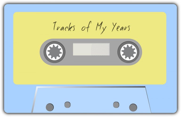 A blue tape cassette with a yellow label. Tracks of My Years is written on the label