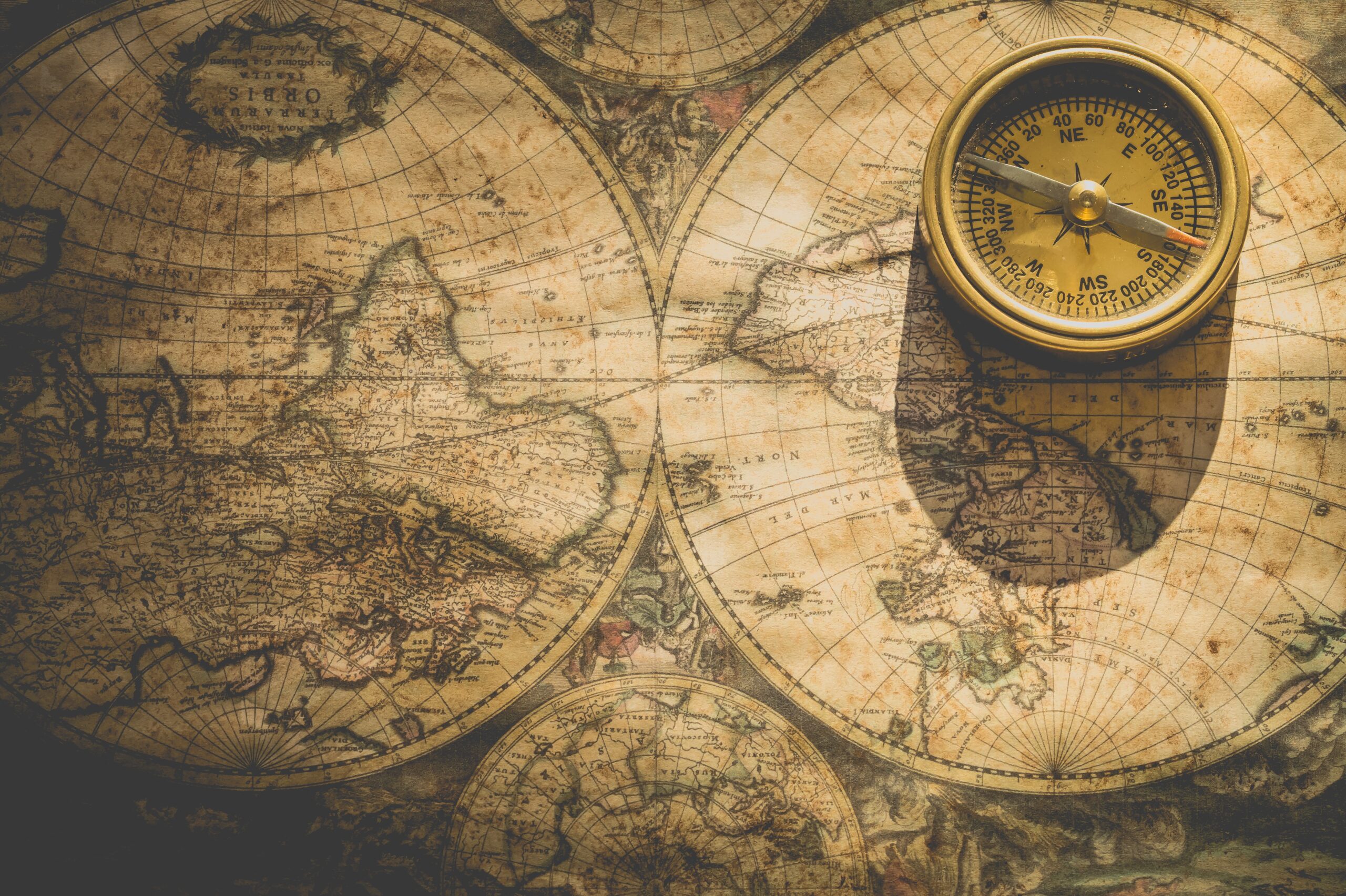 old circular maps and a compass