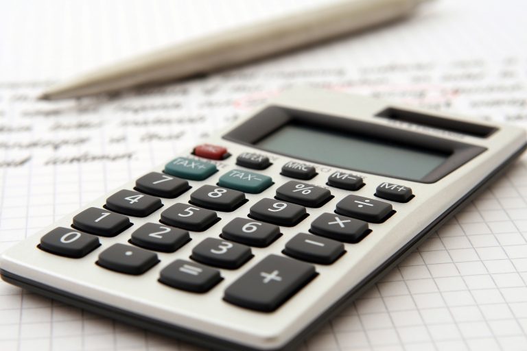 a calculator sat on top of a piece of paper