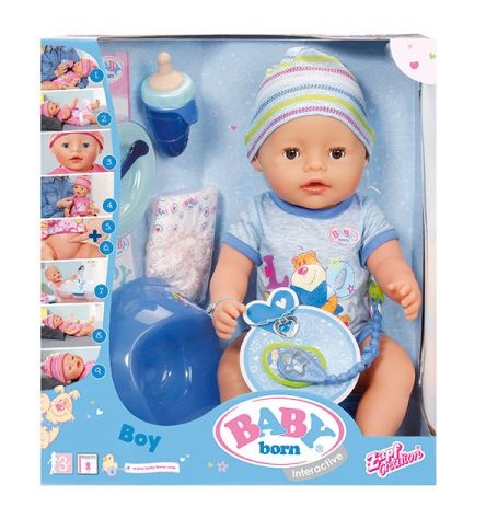 Boxed BABY Born Interactive Doll boy wearing a blue outfit and striped hat, with accessories such as bottle, nappy, and dummy. The packaging features product images and BABY born branding.