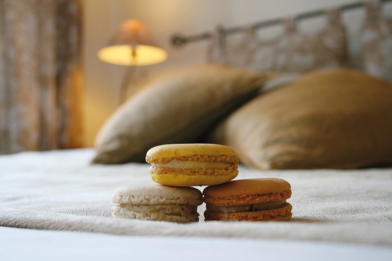 three macarons sat on top of a bed