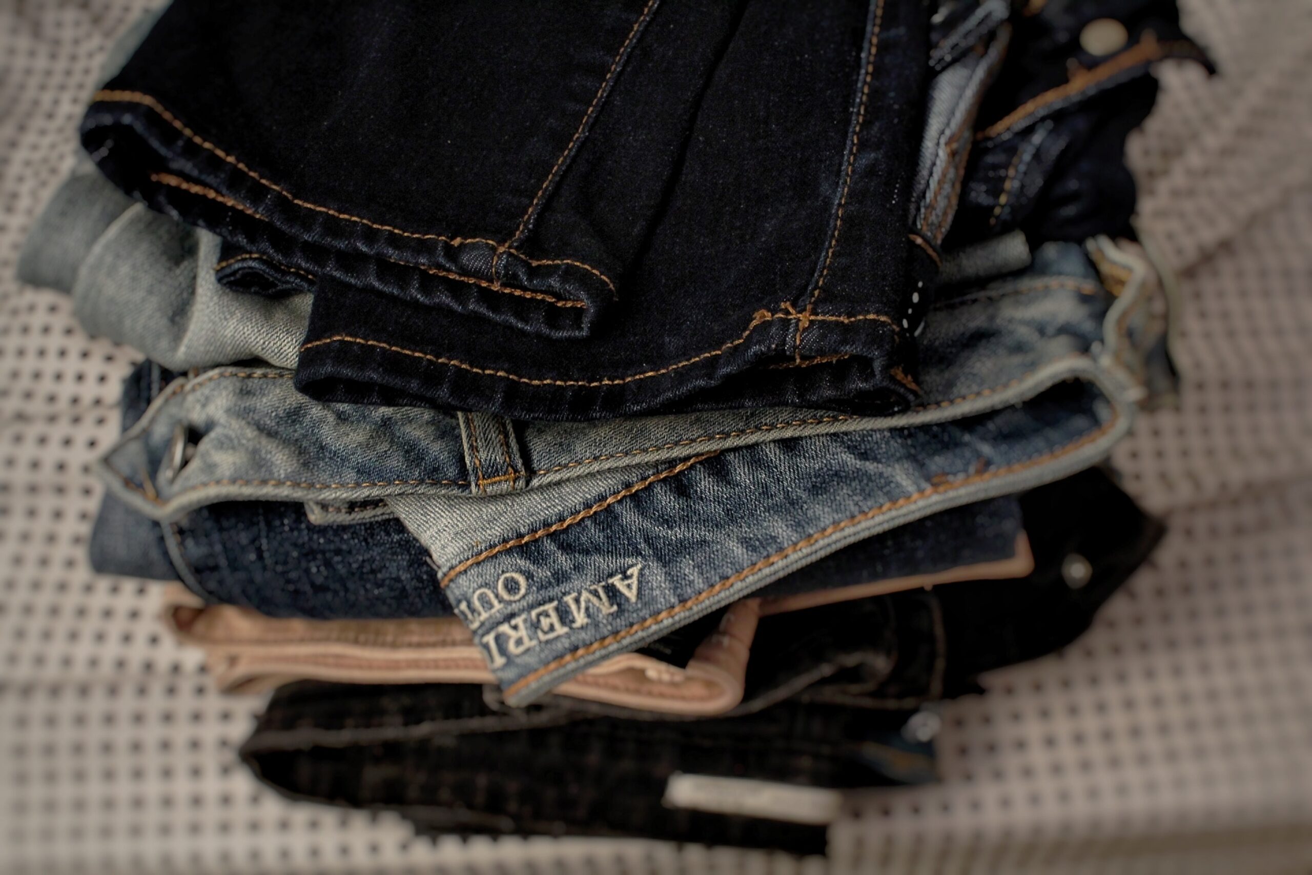 A pile of folder pairs of jeans