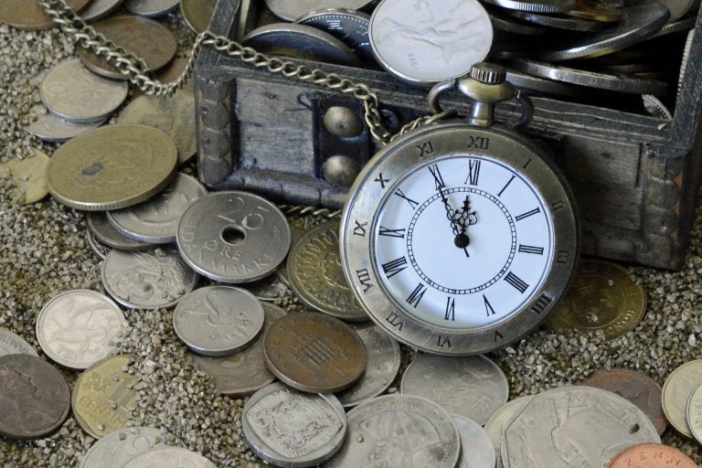 pocket watch and lots of old coins