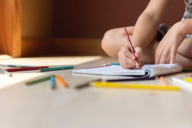 A child colouring in a picture