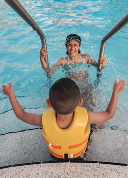 A person in a pool of water  Description automatically generated