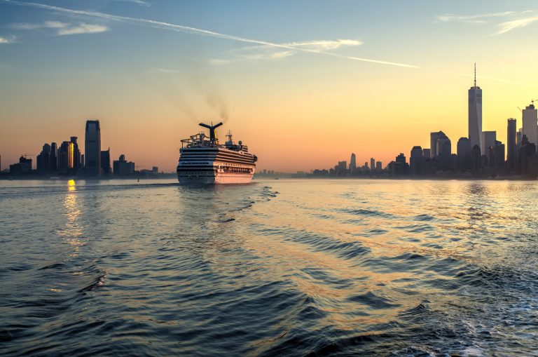 A cruise ship coming into port in New York at Sunset