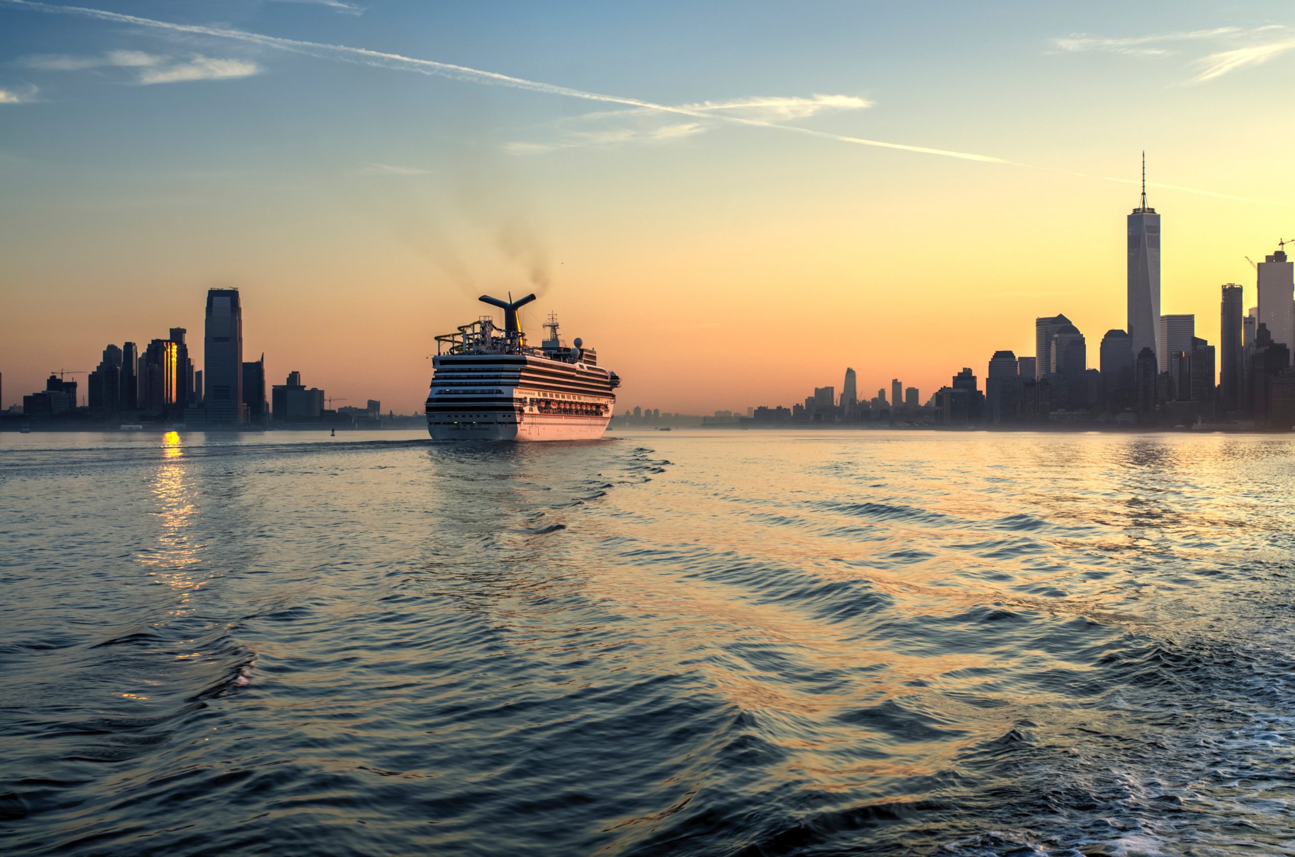 A cruise ship coming into port in New York at Sunset