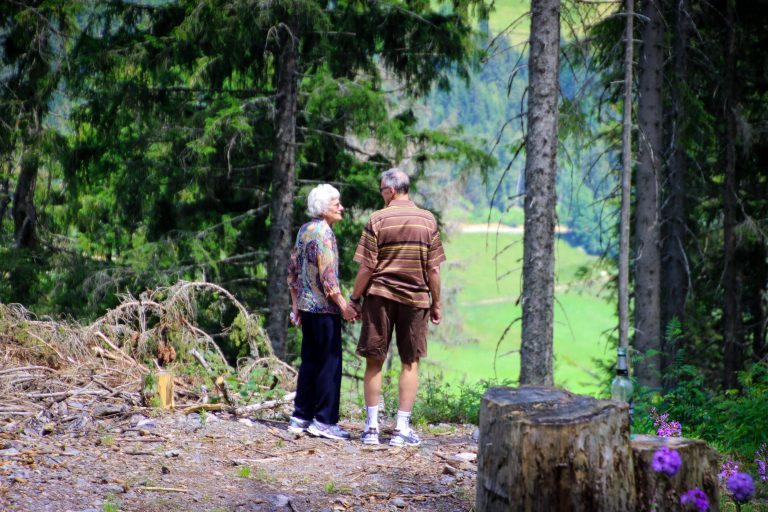 an old couple stood looking into the distance