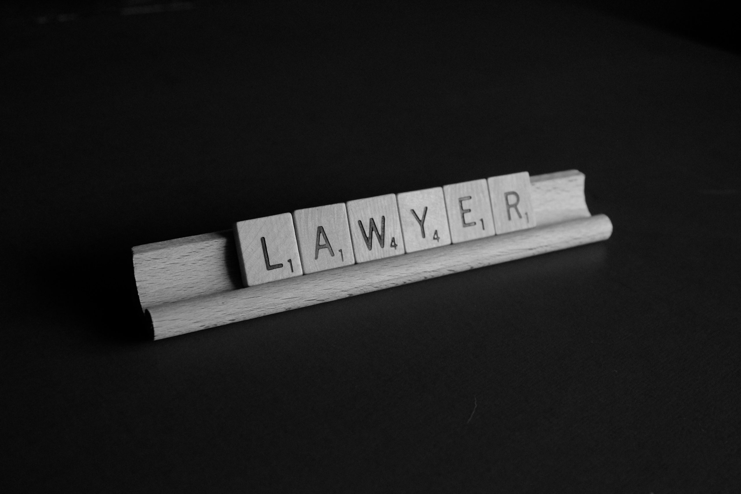 The letter lawyer spelt out in scrabble tiles