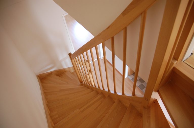 hallway flooring from the tops of a wooden staircase