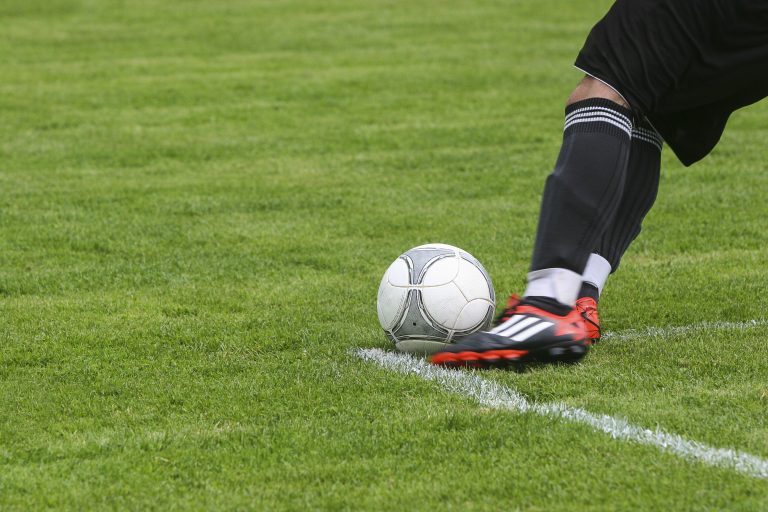 someone playing football - a great hobby for teenagers