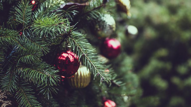 red and gold baubles on a Christmas tree
