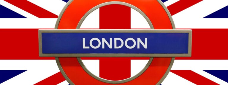 A London Underground roundel sign with "London" in white on a blue bar, set against the vibrant Union Flag, captures the spirit of London’s iconic transport and British heritage.