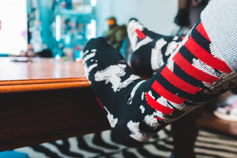 person wearing black white and red socks