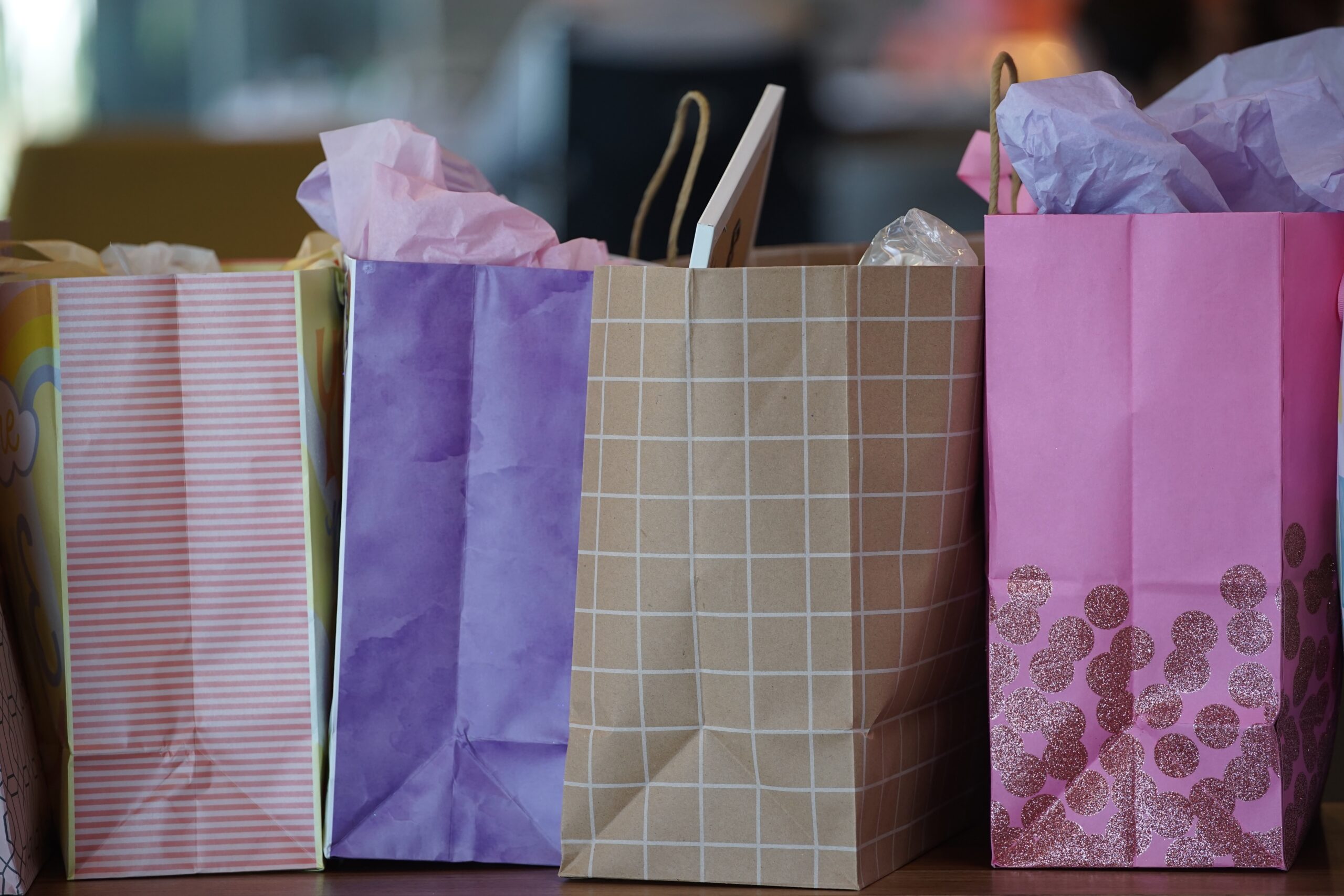 purple and white paper bags
