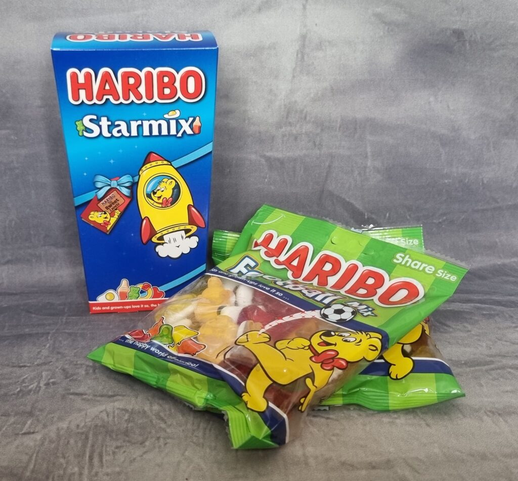 A box of Haribo Starmix and two packets of Haribo Football Mix sweets