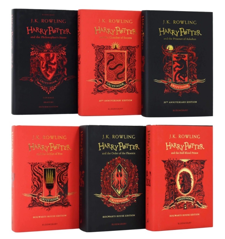 Six hardback Harry Potter books by J.K. Rowling are displayed in two rows with vibrant red and black covers, detailed house crests, and gold anniversary edition labels. Enter for a chance to Win Three Children's Book Sets!.