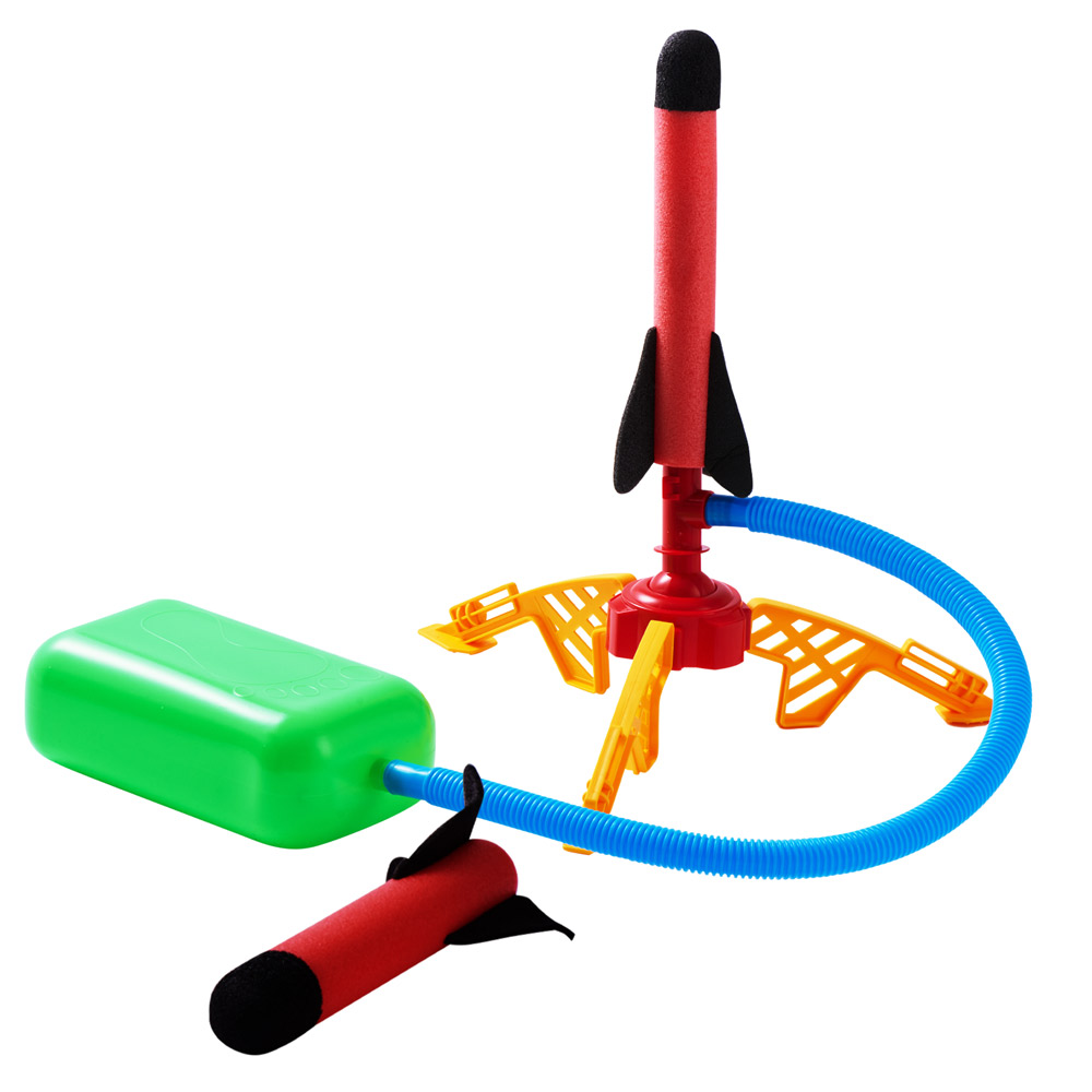 A toy rocket launcher set with a green foot pump, blue hose, red and yellow launch pad, and two foam rockets—perfect for outdoor fun or as a Summer Prize Giveaway from Top UK Bloggers. One rocket is ready to launch; the other lies on the ground.